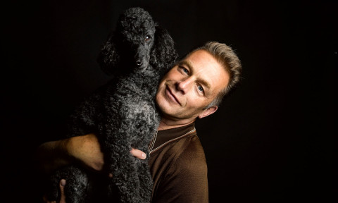 Chris Packham and his black curly-haired dog