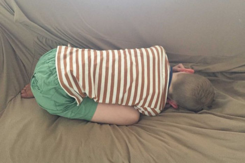 boy lying on floor