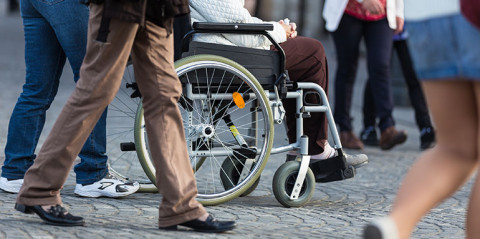 wheel chair in crowd