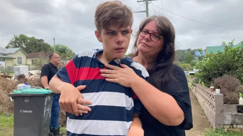 mother holding her autistic son