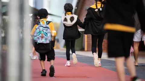 children walking forward (away from camera)