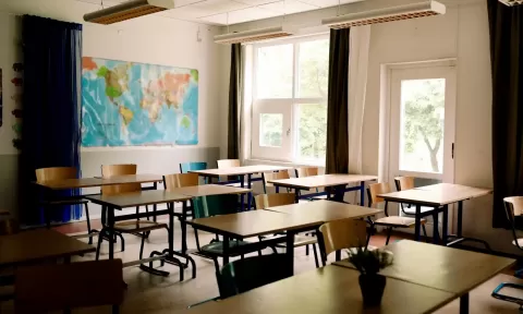 classroom with empty chairs and desks