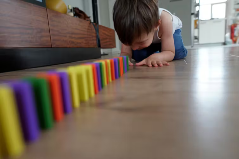 coloured tiles lined up on floor - child crouched at far end Orson Elitok/ShutterstockAndrew Whitehouse, The University of Western Australia; David Trembath, Griffith University, and Sarah Pillar, Telethon Kids Institute