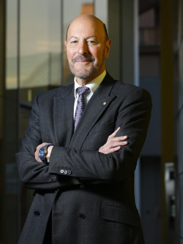 Emeritus Professor Steven Schwartz - suit & tie, arms crossed