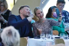 Dylan Alcott OAM and Grace Tame smiling and taking a selfie