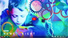 image of boy looking down behind abstract intersecting cogs