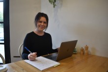 Counsellor (pictured behind desk with laptop open) and owner of Stepping Stones Wellbeing Karmyn Smith is hopeful autism assessments will be offered in regional SA soon.