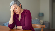 female carer looking worried or stressed